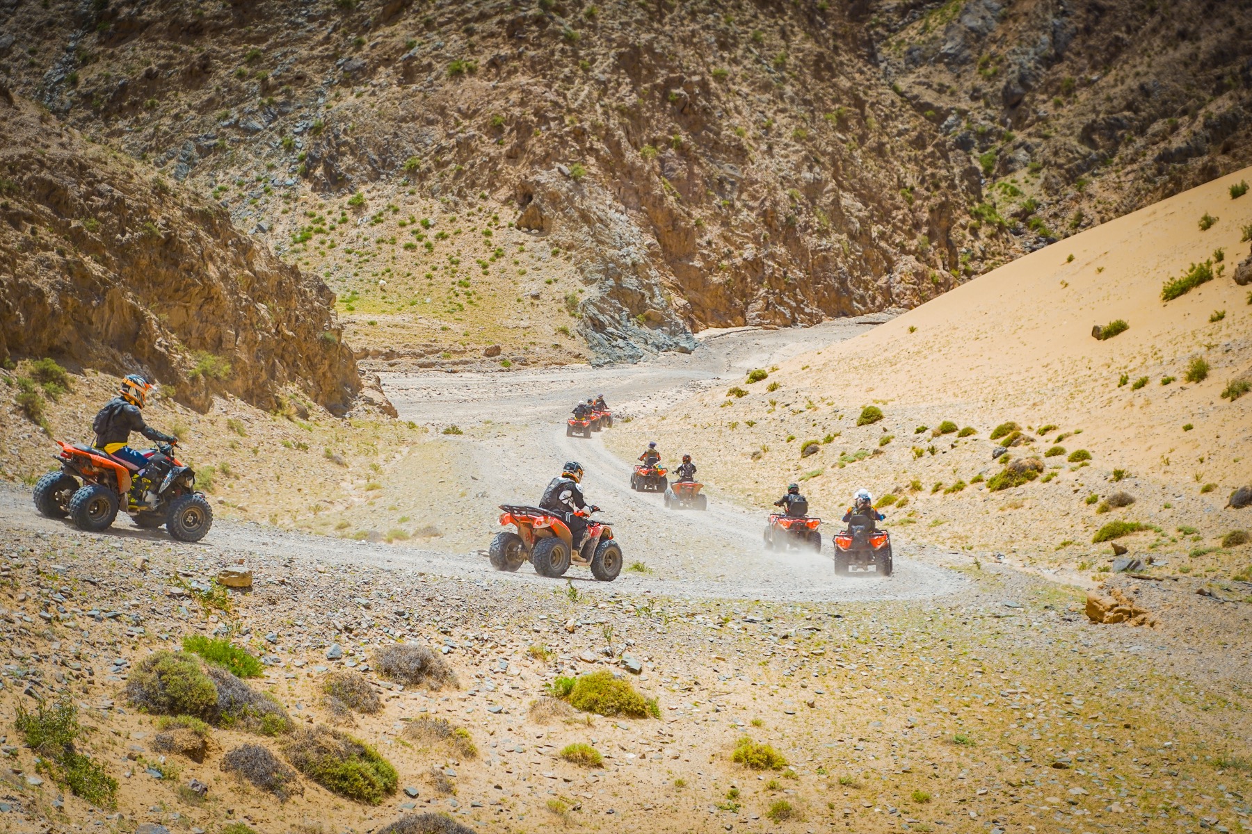Little Knights participants and guides following a route through a wide canyon